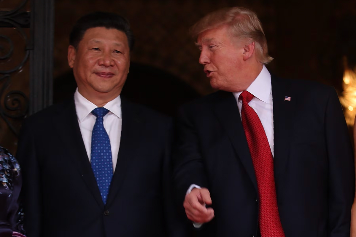 U.S. President Donald Trump talks with Chinese President Xi Jinping