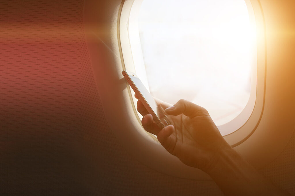 holding mobile phone with flight mode